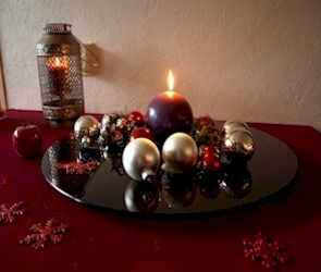 lazy susan with candle and christmas balls